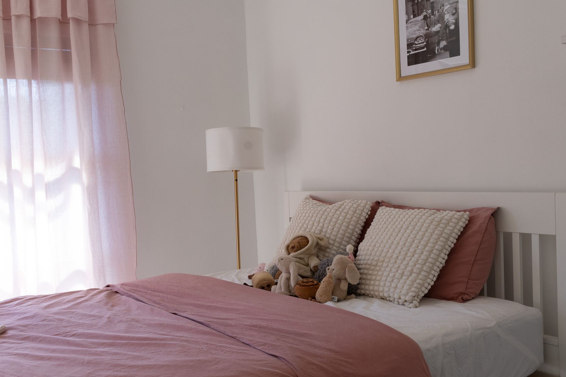 Upstairs bedroom with a pink bedspread