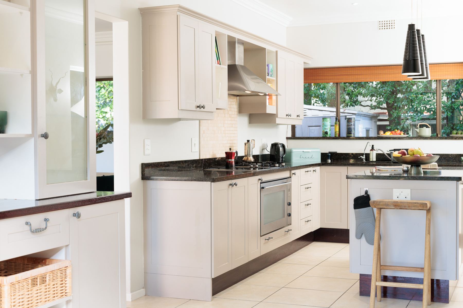 Bright kitchen with a breakfast stool at the island