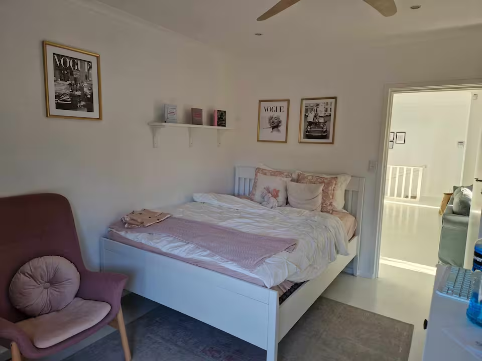 Charming bedroom with Vogue artwork