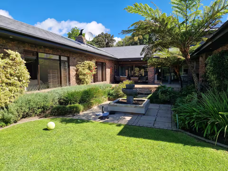 Garden courtyard with fountain and lawn